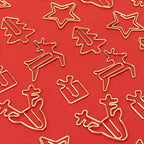 Goldene Weihnachtsclips auf Rot