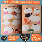 Doppelseite mit Geburtstagsübersicht und gezeichneten Katzen und Dinos