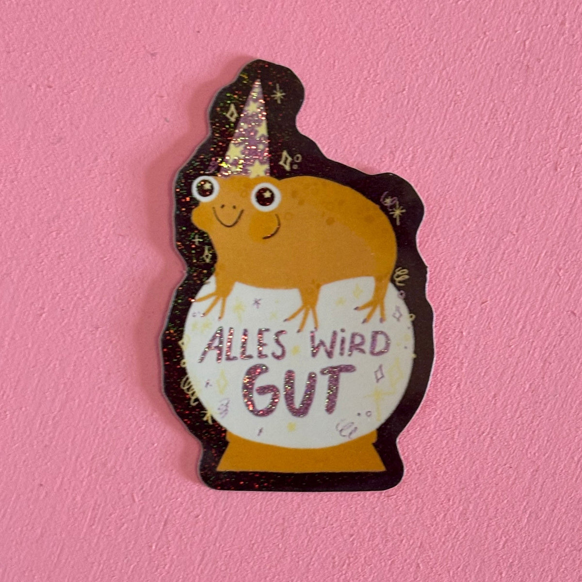 Glitzersticker Kröte mit Zauberhut auf Glaskugel, Schriftzug Alles wird gut