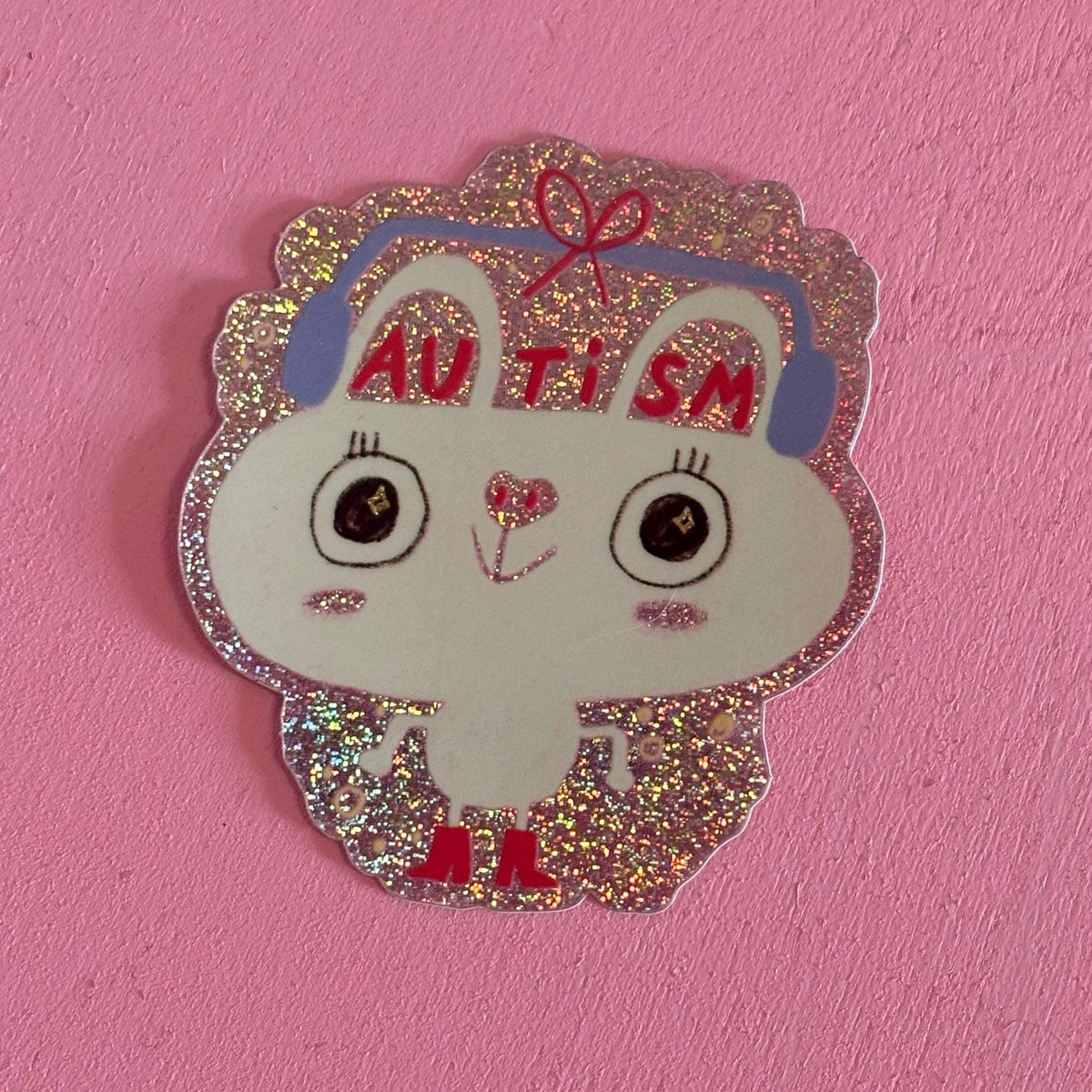 Glitzersticker Hase mit Kopfhörern und Schriftzug Autism
