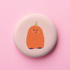 Runder Magnet mit buntem Monster