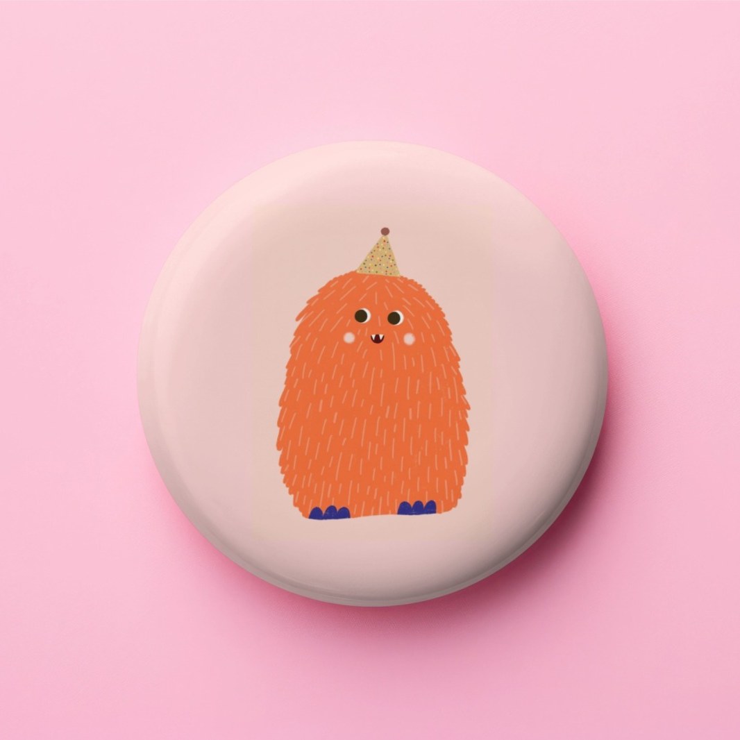 Runder Magnet mit buntem Monster