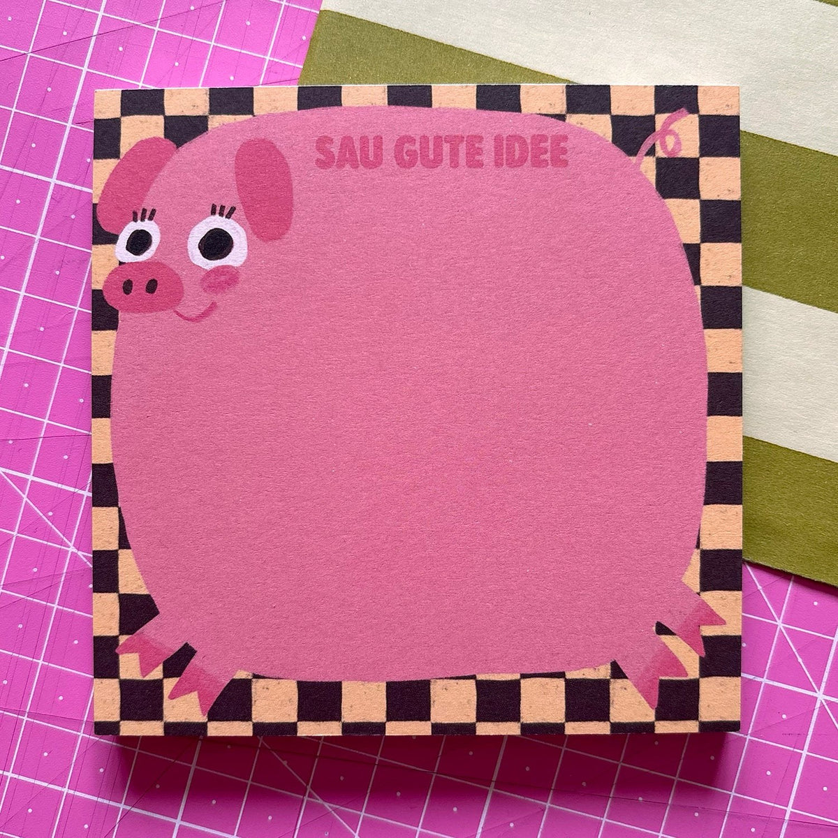 Quadratischer rosa Notizblock mit Schweinchen und Karorand